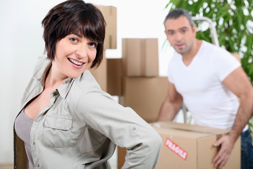 Customer service representative assisting with large item collection in Luton